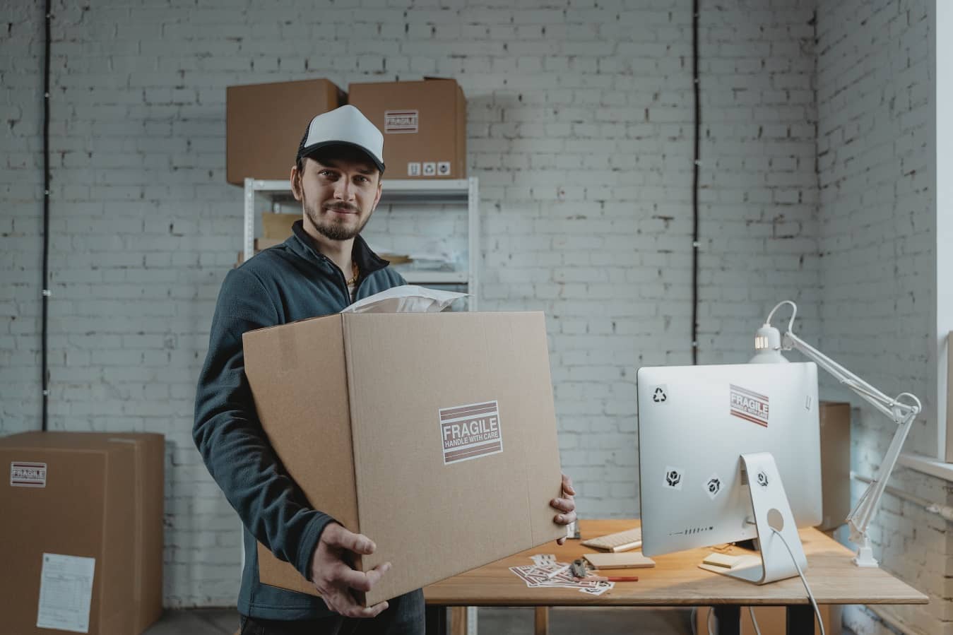 A man holding ecommerce shipping package